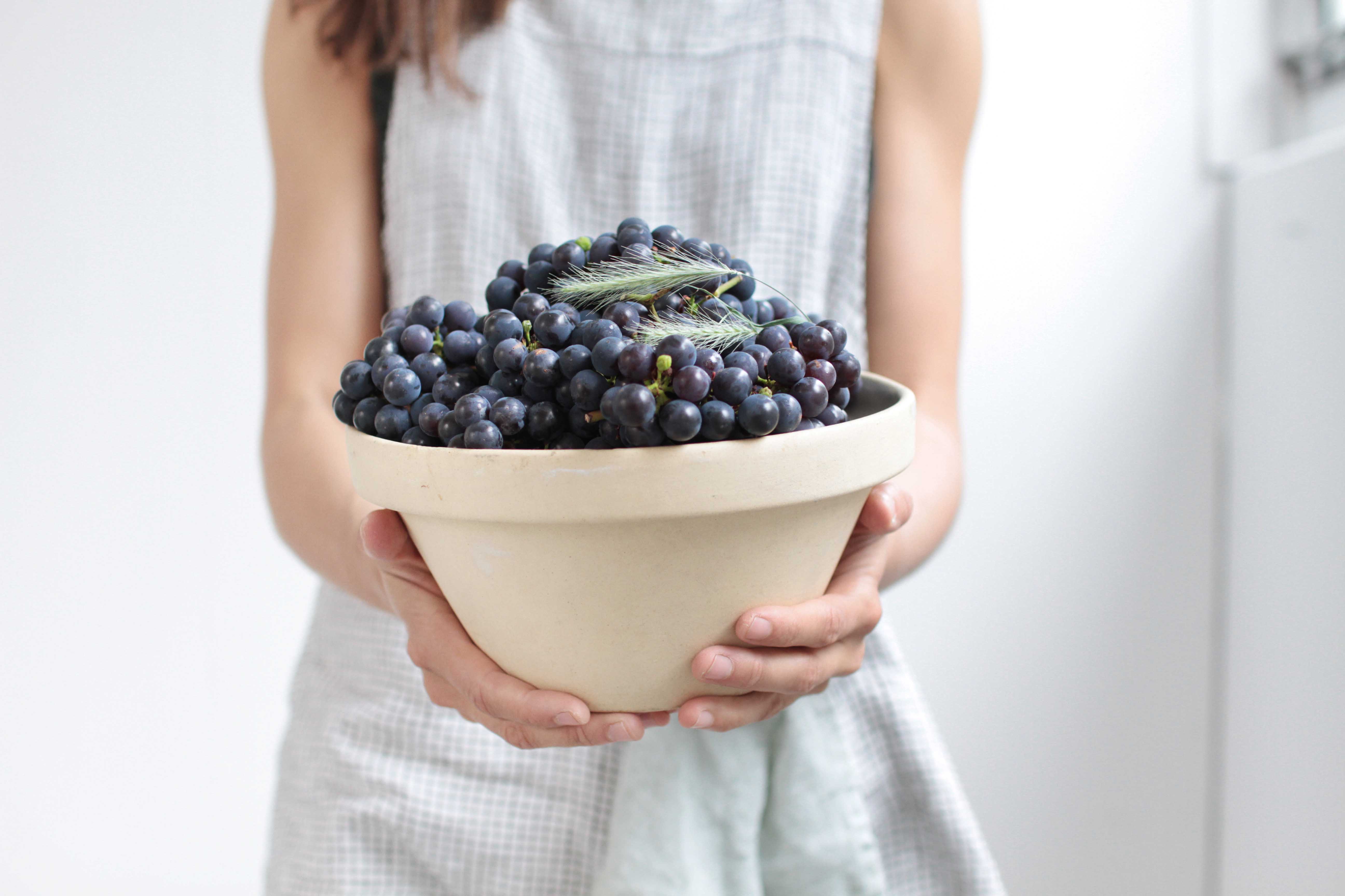 kyra holding grapes studiospacekyra